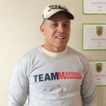 Man Wearing Gray Team Marshall T-Shirt from Marshall Building & Remodeling