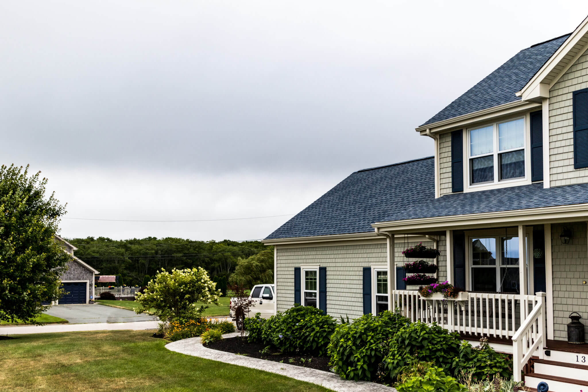 This MA home has new vinyl siding, roofing, & replacement windows