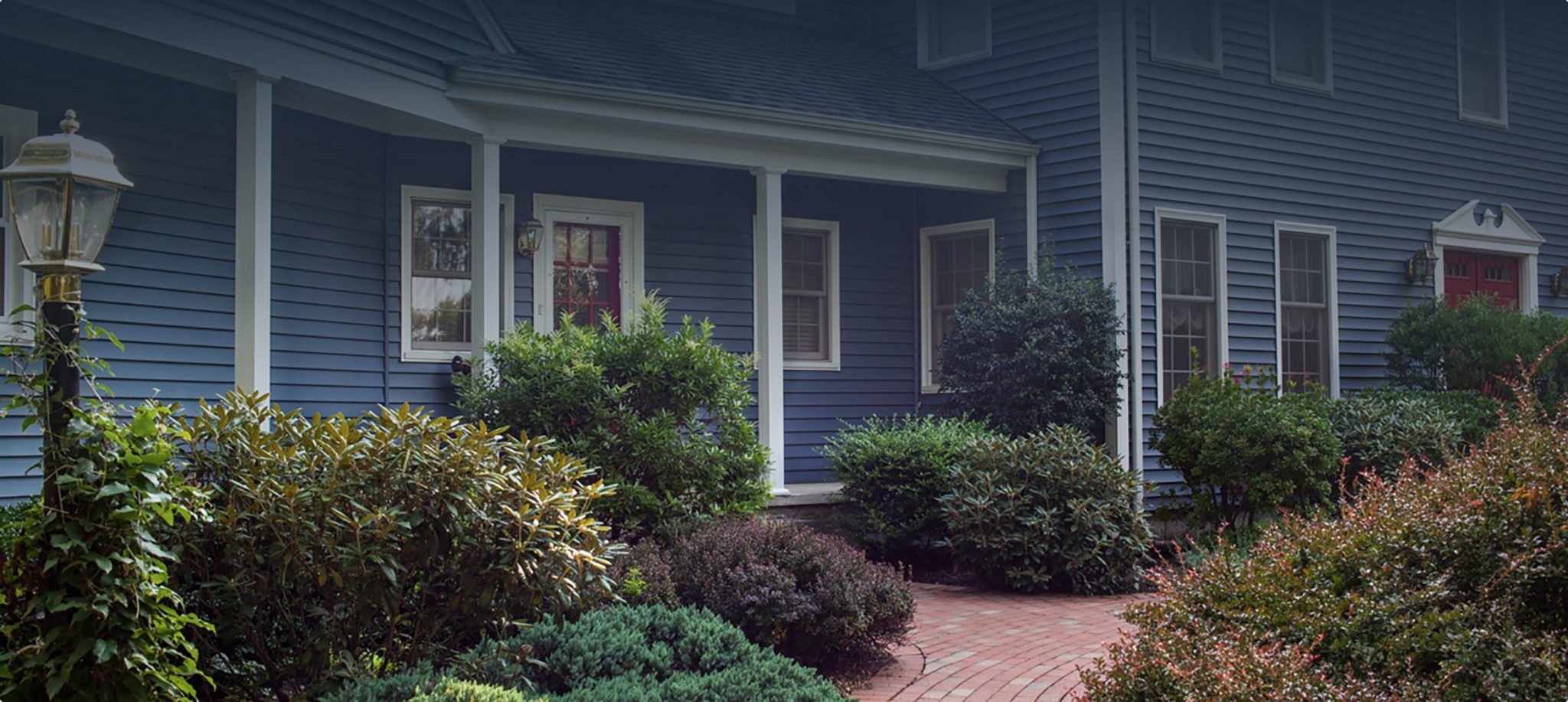 Vibrant Blue Vinyl Siding on Remodeled RI Home Exterior