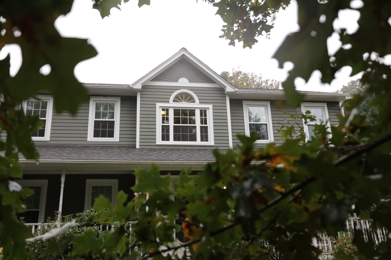 Harvey Elite Windows with Colonial Grids Installed on MA Colonial Home with Gray Vinyl Siding