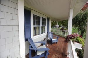 Mastic Cedar Discovery 5″ Siding in Tuscan Olive with White Cameo Trim Installed on RI Home
