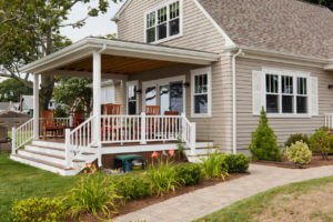 Natural Wood Look Siding Installed on Beachy Home by RI Vinyl Siding Installers Marshall Building & Remodeling