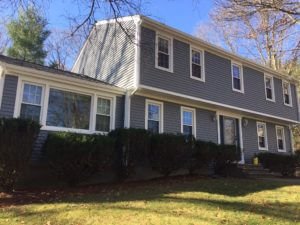 Gray Vinyl Siding and Window Installation on a Raised Ranch Home in MA