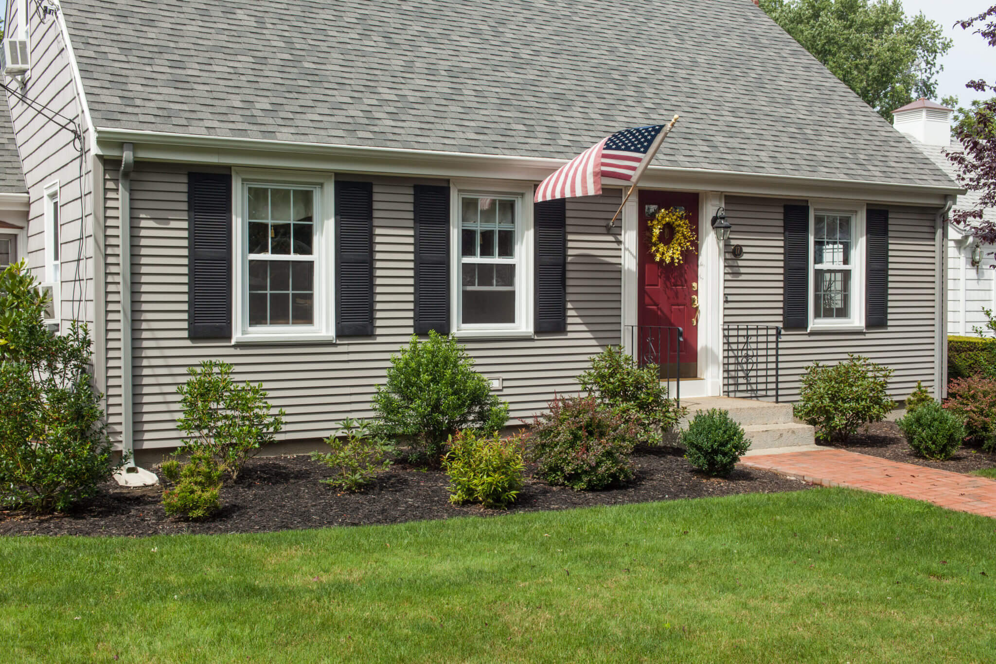 Roofing, Siding, & Windows Installed on RI Cape House by Marshall Building & Remodeling