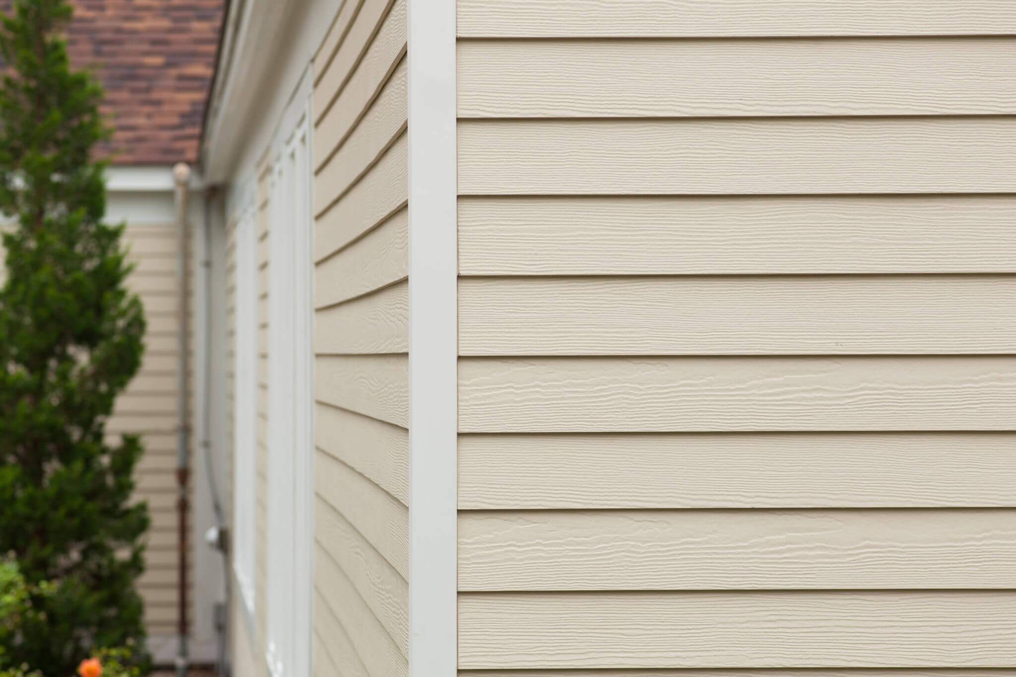 Cream Vinyl Siding Installation on MA Home by Marshall Building & Remodeling