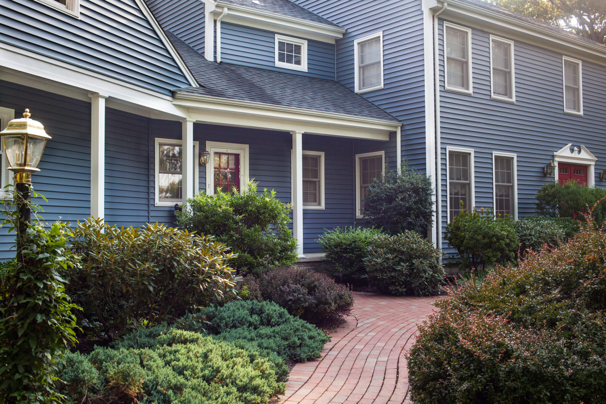 Blue Vinyl Siding Installed on a Remodeled Colonial Home in RI by Marshall Building & Remodeling