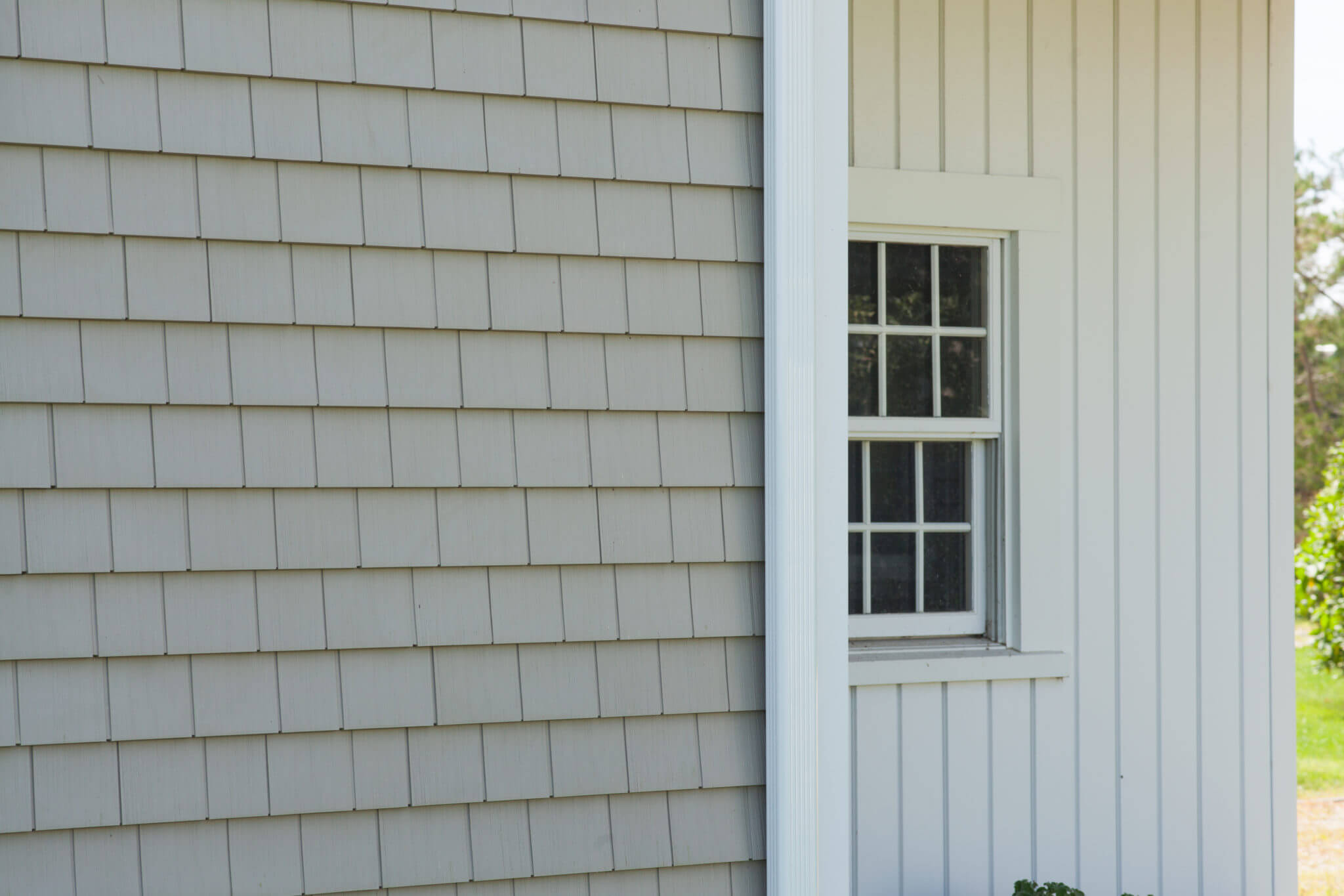 RI Home Exterior with Cedar Style Vinyl Siding and Vertical Vinyl Siding