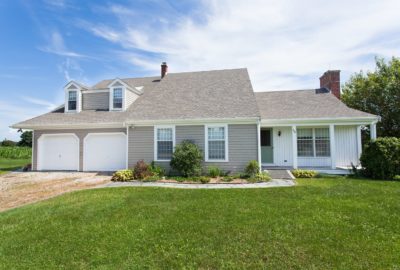 RI & MA Siding Installation: Cedar Impressions in Natural Clay with Vertical Siding in Snow White