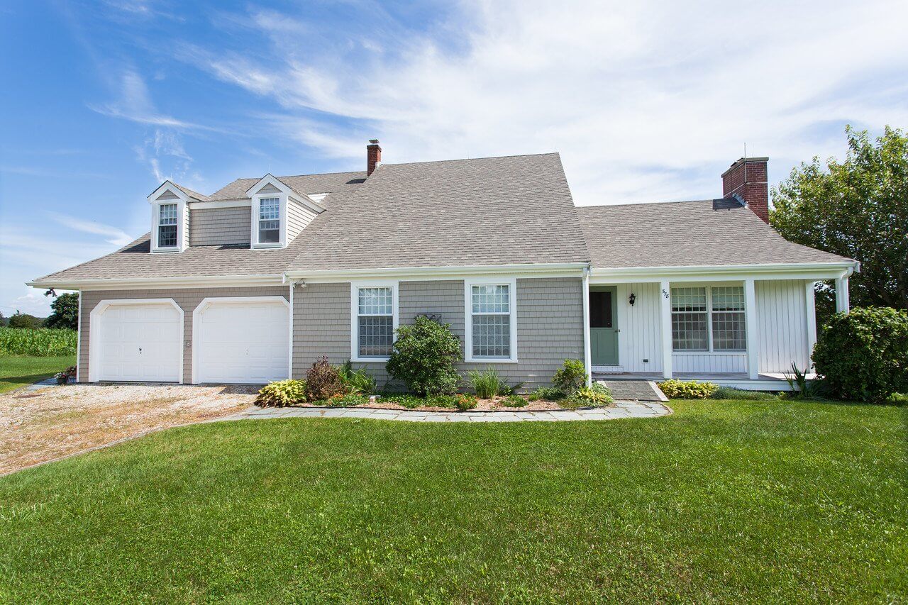 RI & MA Siding Installation: Cedar Impressions in Natural Clay with Vertical Siding in Snow White