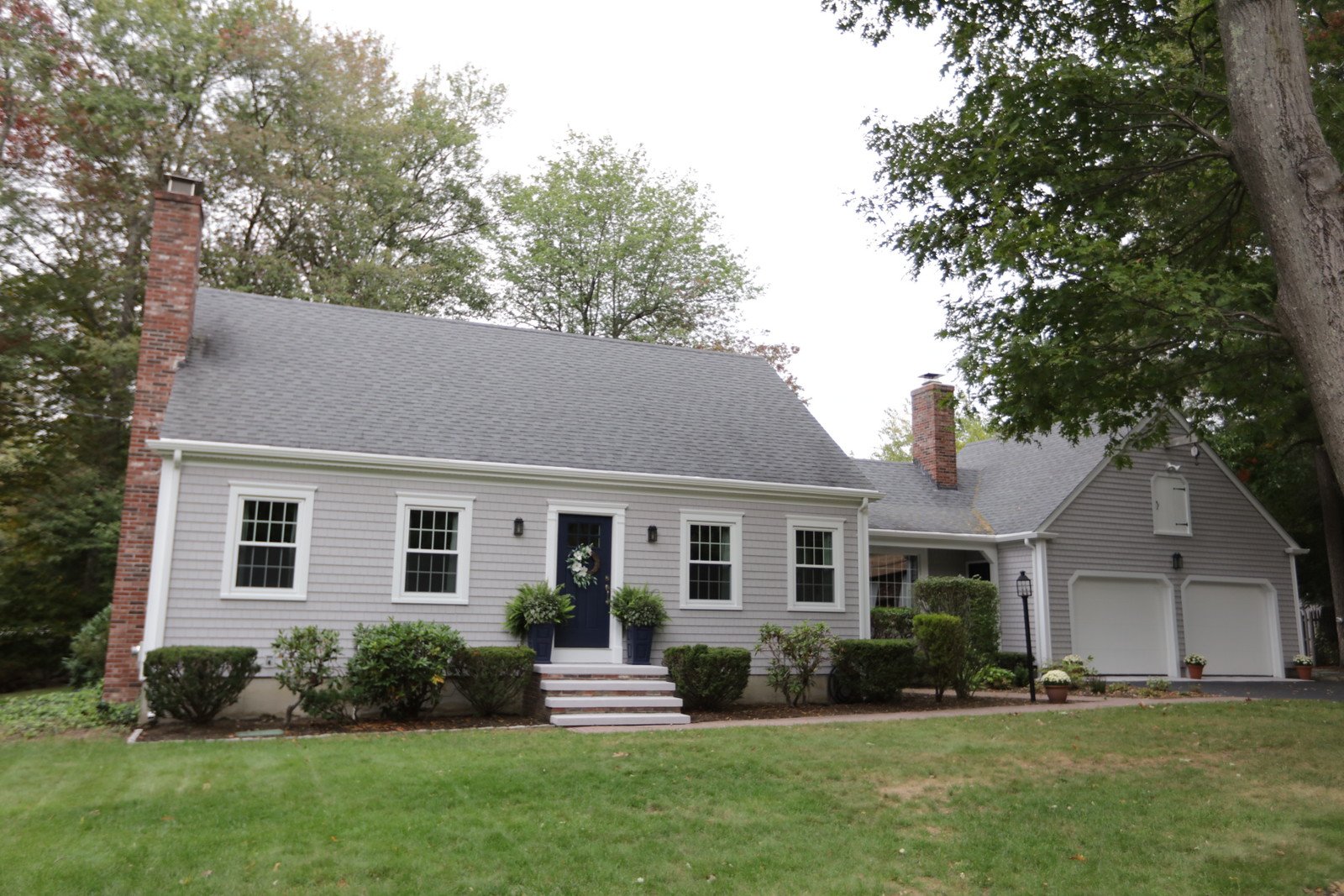 Light Gray Cedar Impressions Siding Installed on RI Cape Home and 2 Car Garage