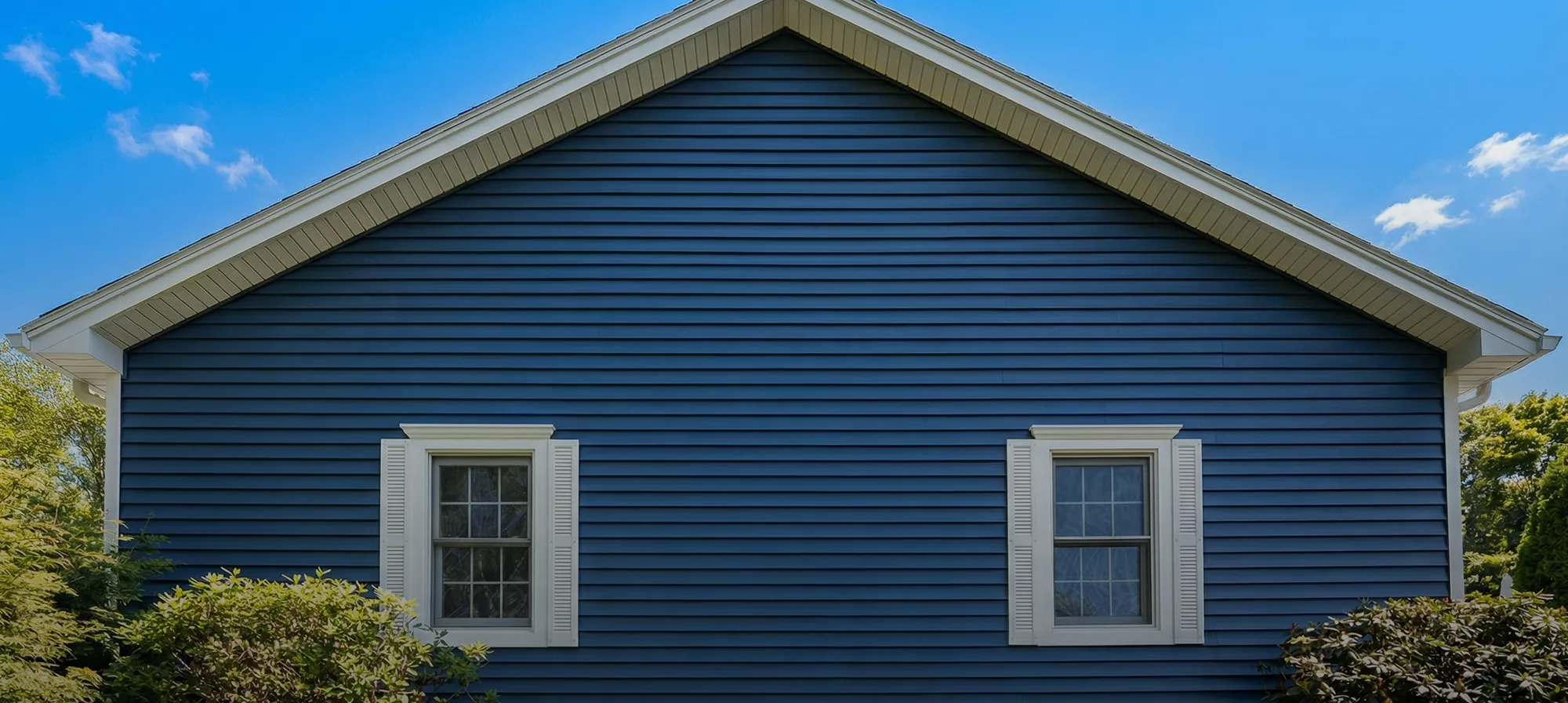 blue house with new siding and windows