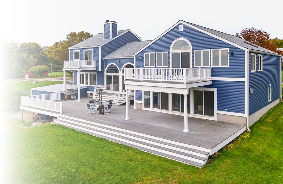 Blue home with new roof, siding, and windows